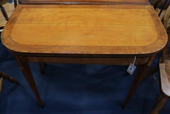 A George III satinwood D-shaped card table with folding top (a.f.), W.92cm